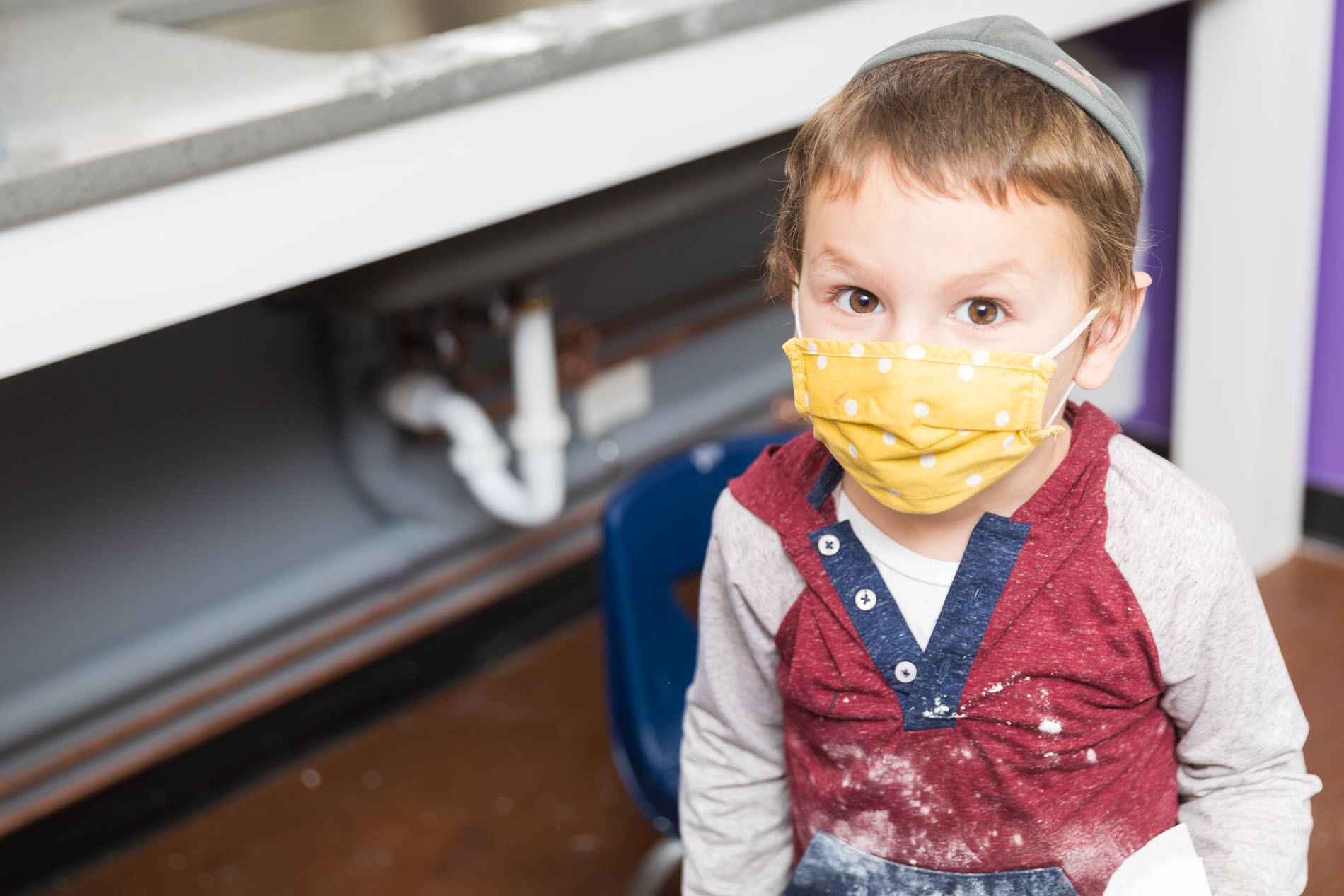 LIttle boy in mask.